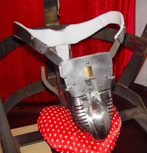 9. A brand-new Carrara chastity belt ready to be locked on a new male slave for the first time. Note the small keys still sticking from underneath into the gold-colored encased padlock above the only slightly bulging penis tube in the center