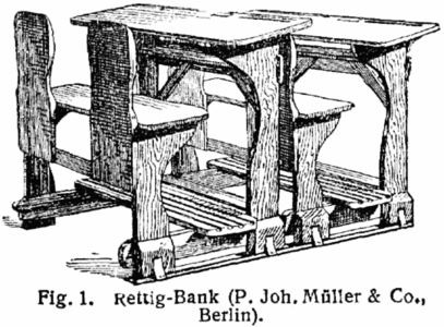 An early 20th century desk designed to be used by 4 people.