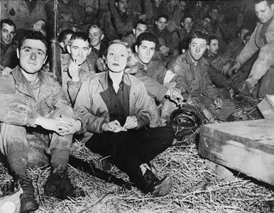 Dietrich and U.S. soldiers somewhere in France during her second USO tour (1944)