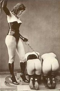 A mistress flogs her female slaves. Photo by Biederer Studio (c. 1930s).