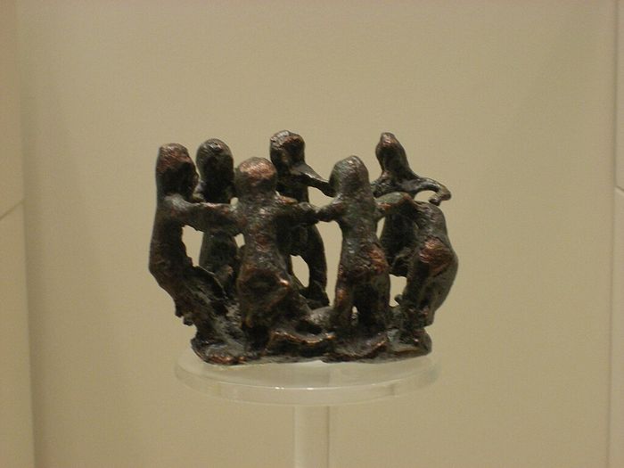Women dancing. Ancient Greek bronze, 8th century BCE, (Archaeological Museum of Olympia).