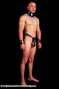 33. The new slave of pic 6 securely belted! Delivered complete with collar and cuffs from the same manufacturer. Picture made by Coolpictures for Carraradesigns