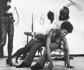 Black girl paddled in 1969 New York stag reel.